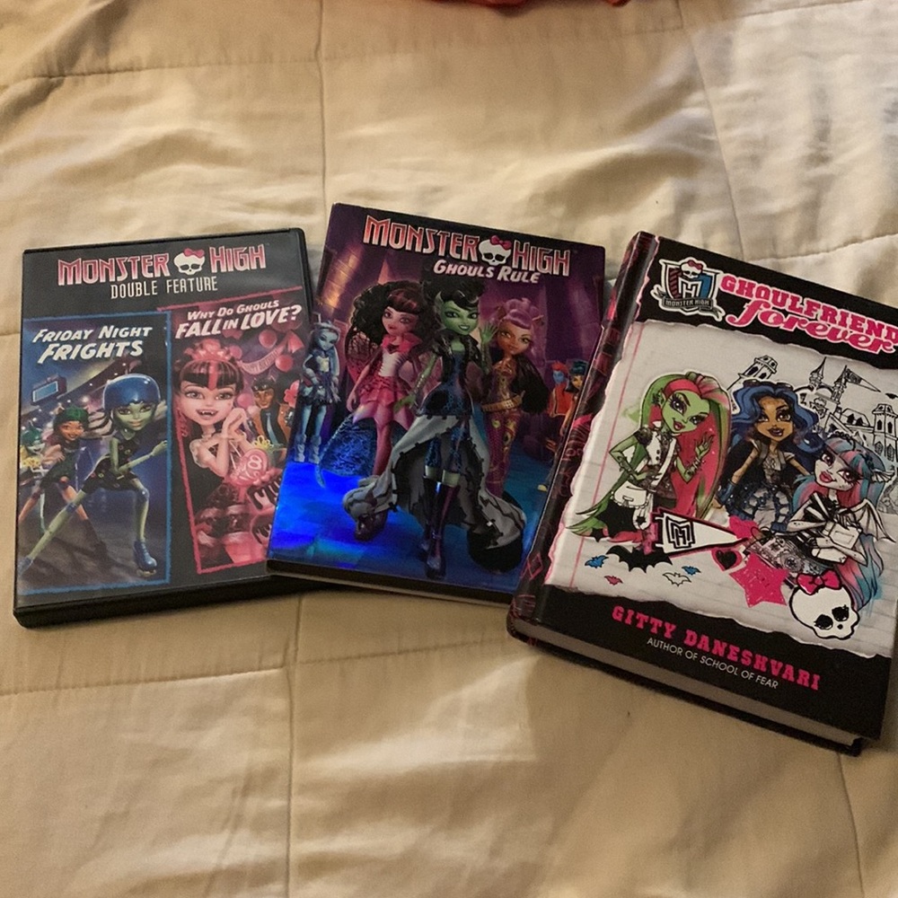 Monster high one hard cover book and two DVDs